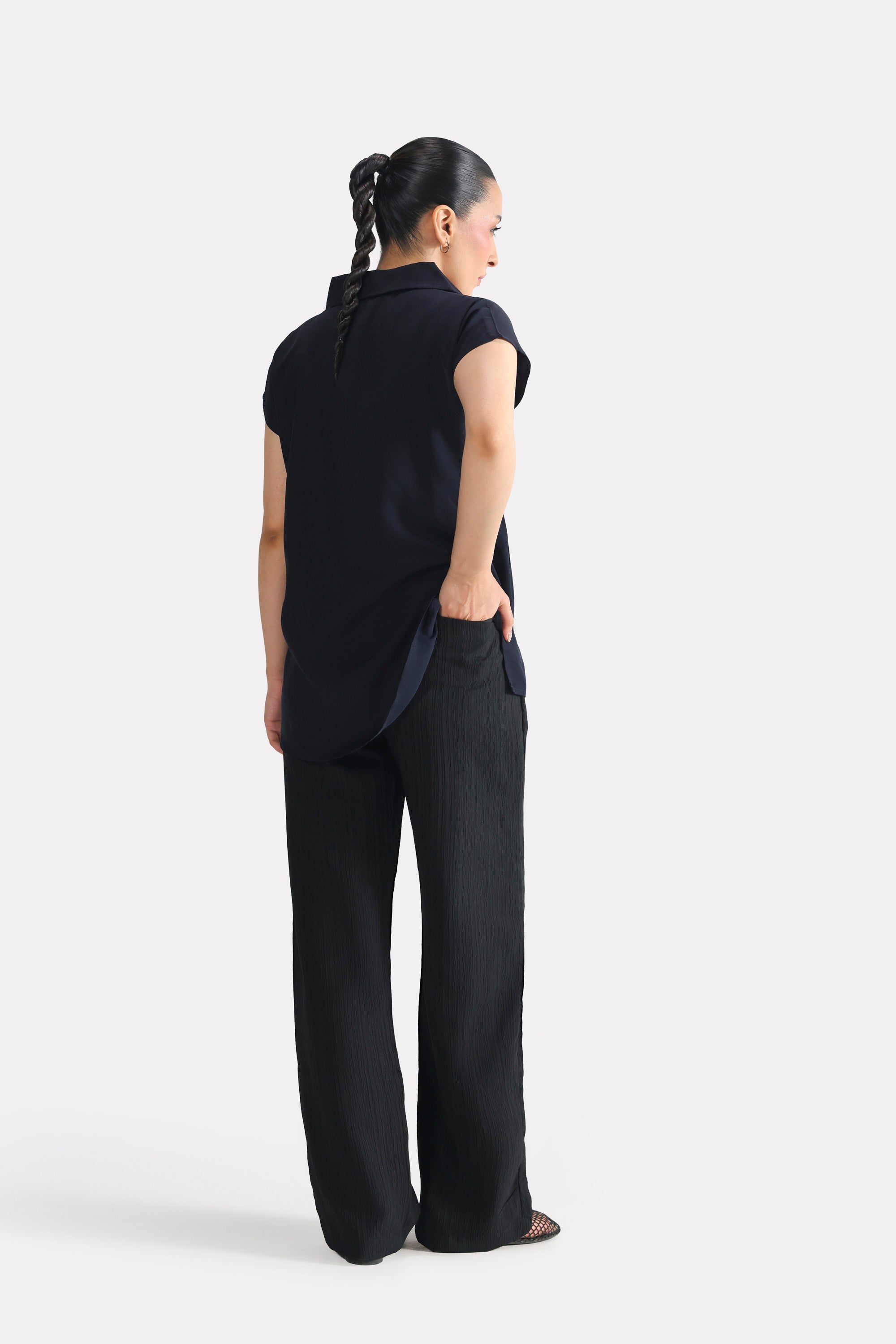 Flat lay of the black retro wide-leg trouser, by SOLA Pakistan.