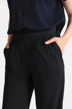 Texture and fabric detail, black retro wide-leg trouser, by SOLA Pakistan.