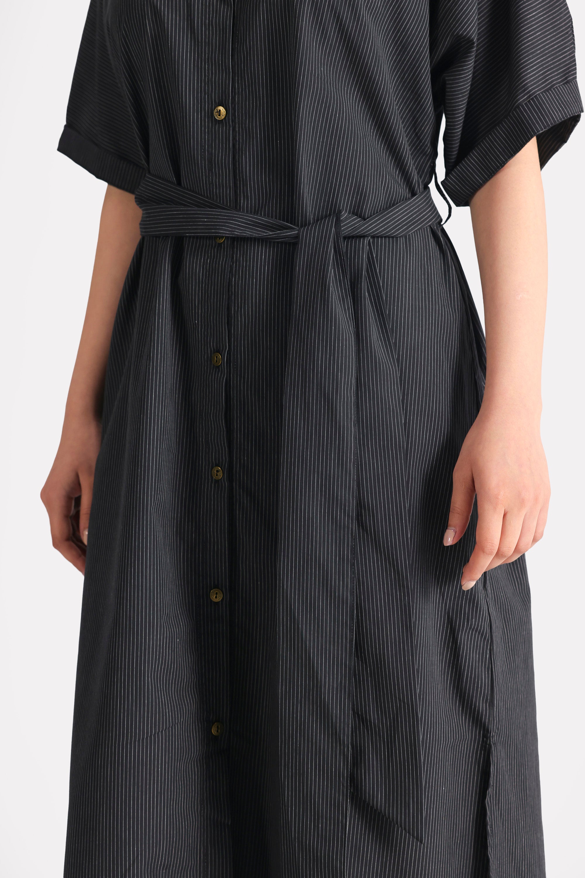 Black & white stripe striped cotton belted dress shown in a styled fit, by SOLA Pakistan.