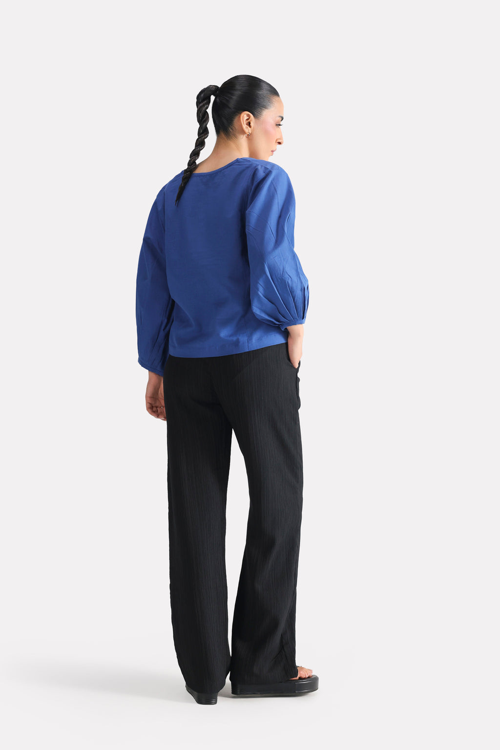 Close-up detail on the blue (french blue) balloon sleeve relaxed top, by SOLA Pakistan.