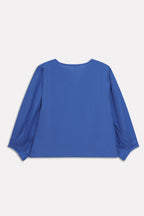 Flat lay of the blue (french blue) balloon sleeve relaxed top, by SOLA Pakistan.