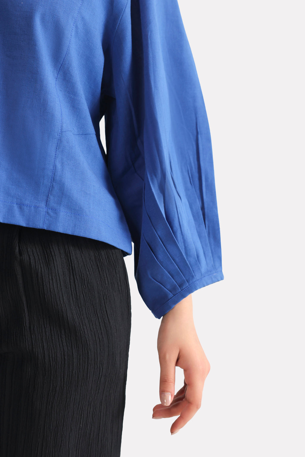 Texture and fabric detail, blue (french blue) balloon sleeve relaxed top, by SOLA Pakistan.