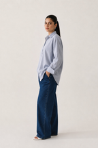 Close-up detail on the blue stripe button-up stripe shirt, by SOLA Pakistan.
