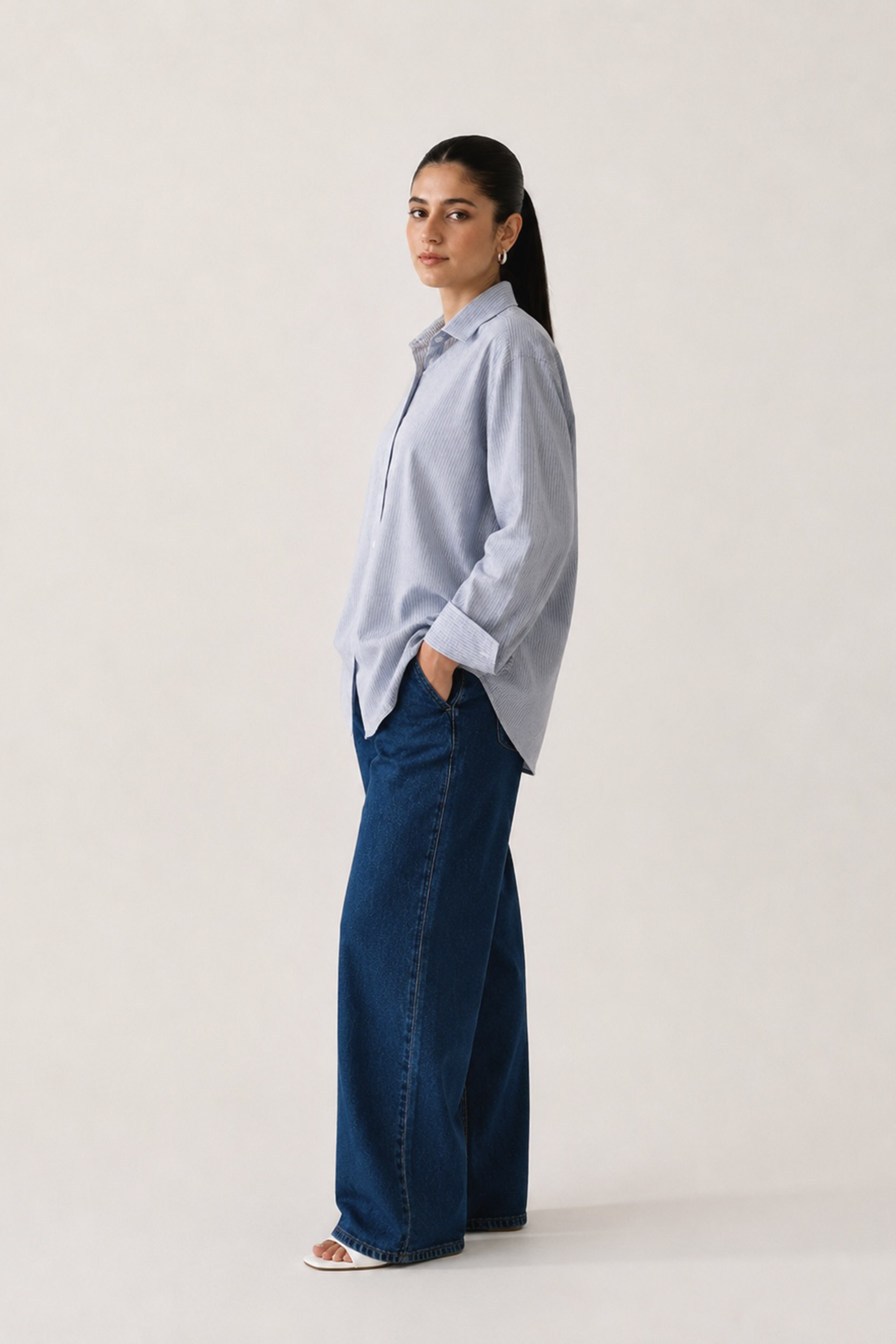 Close-up detail on the blue stripe button-up stripe shirt, by SOLA Pakistan.