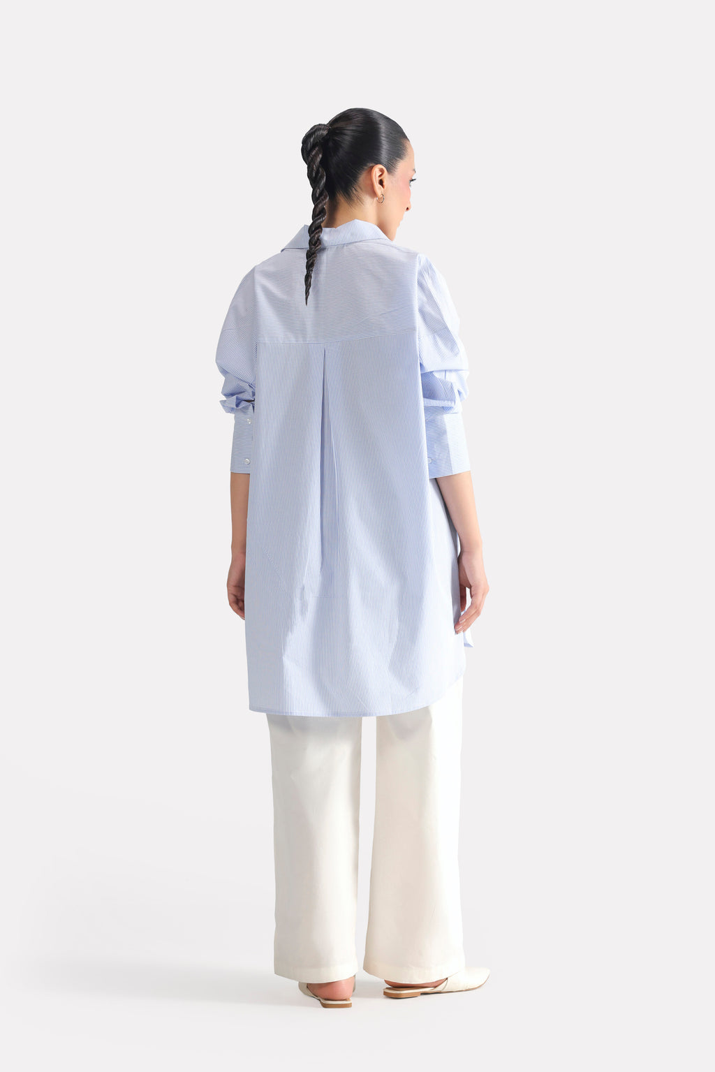 Close-up detail on the blue & white stripe oversized boyfriend shirt, by SOLA Pakistan.