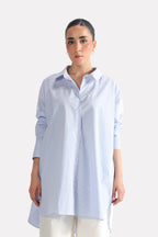 Blue & white stripe oversized boyfriend shirt in cotton, worn by a model, by SOLA Pakistan.