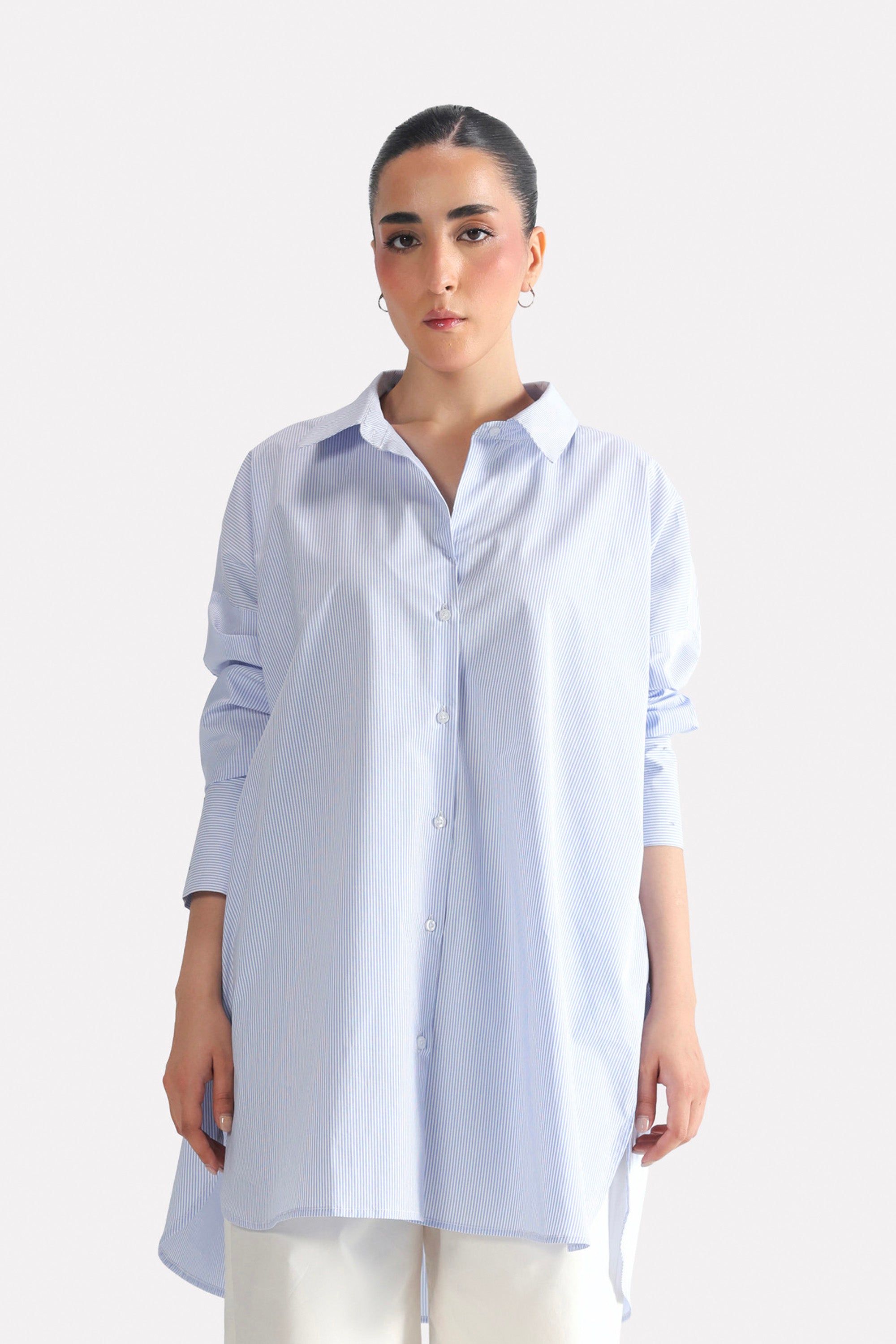 Blue & white stripe oversized boyfriend shirt in cotton, worn by a model, by SOLA Pakistan.