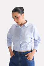 Blue & white stripe sleek striped collar shirt in cotton, worn by a model, by SOLA Pakistan.