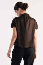 Chocolate brown drapped high neck asymmetrical shown in a styled fit, by SOLA Pakistan.