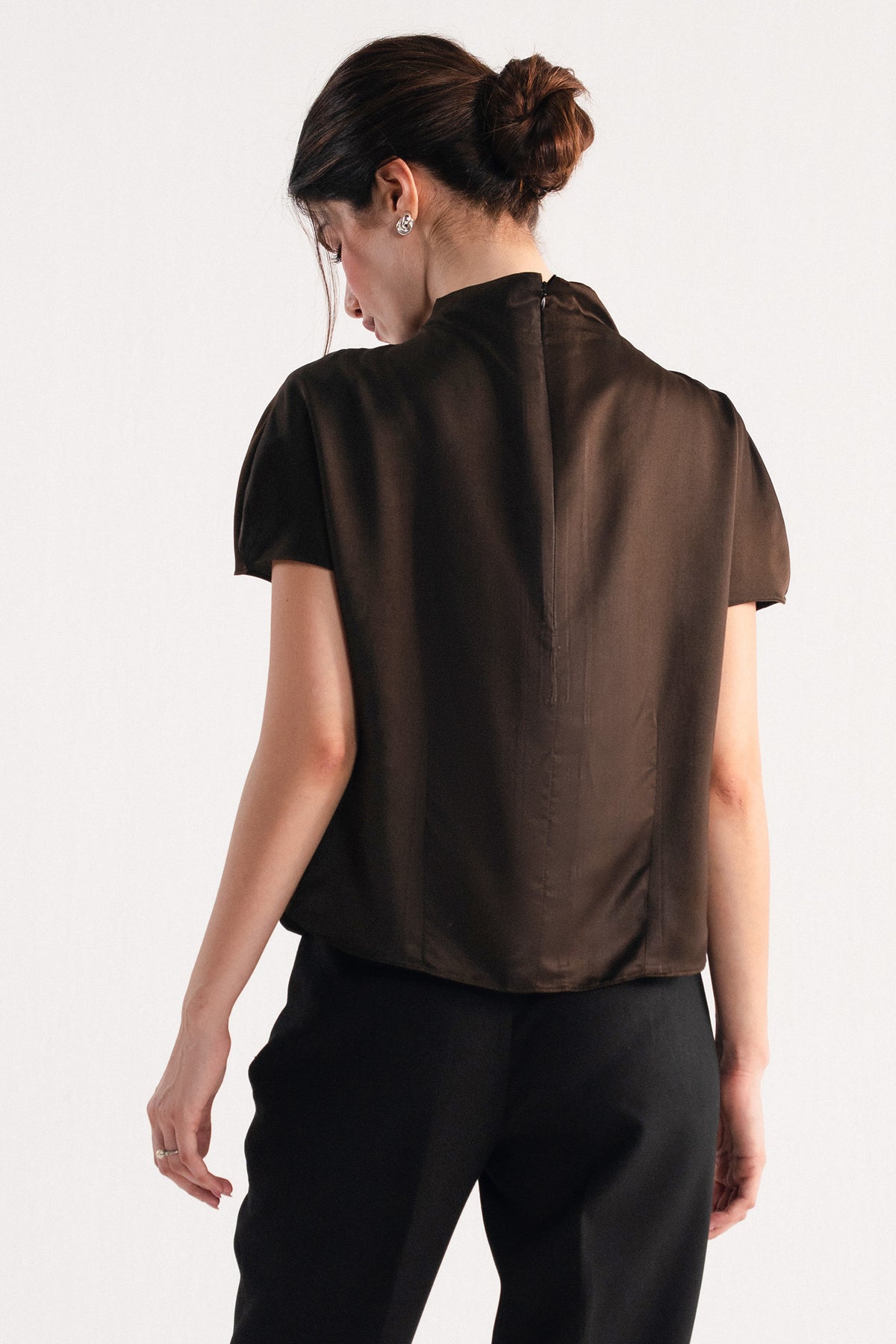 Chocolate brown drapped high neck asymmetrical shown in a styled fit, by SOLA Pakistan.