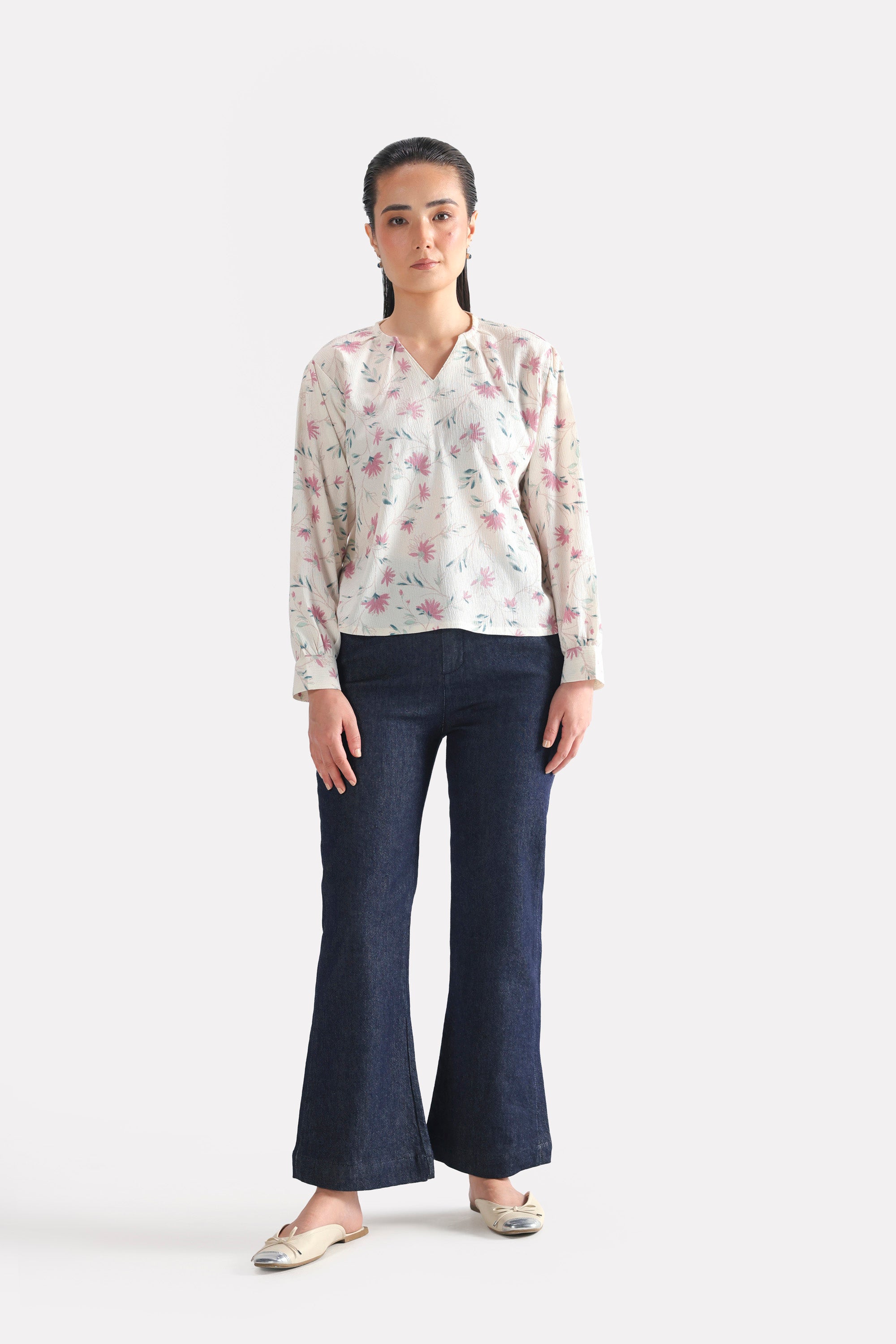 Dark blue bootcut denim jean in cotton, worn by a model, by SOLA Pakistan.