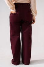 Close-up detail on the dark purple (plum) flared pant, by SOLA Pakistan.