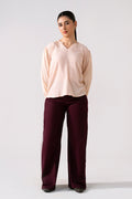 Dark purple (plum) flared pant in cotton, worn by a model, by SOLA Pakistan.