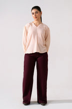 Dark purple (plum) flared pant in cotton, worn by a model, by SOLA Pakistan.