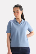 Faded blue (faded denim) jhonny collar polo t-shirt in cotton, worn by a model, by SOLA Pakistan.