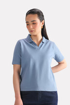 Faded blue (faded denim) jhonny collar polo t-shirt in cotton, worn by a model, by SOLA Pakistan.