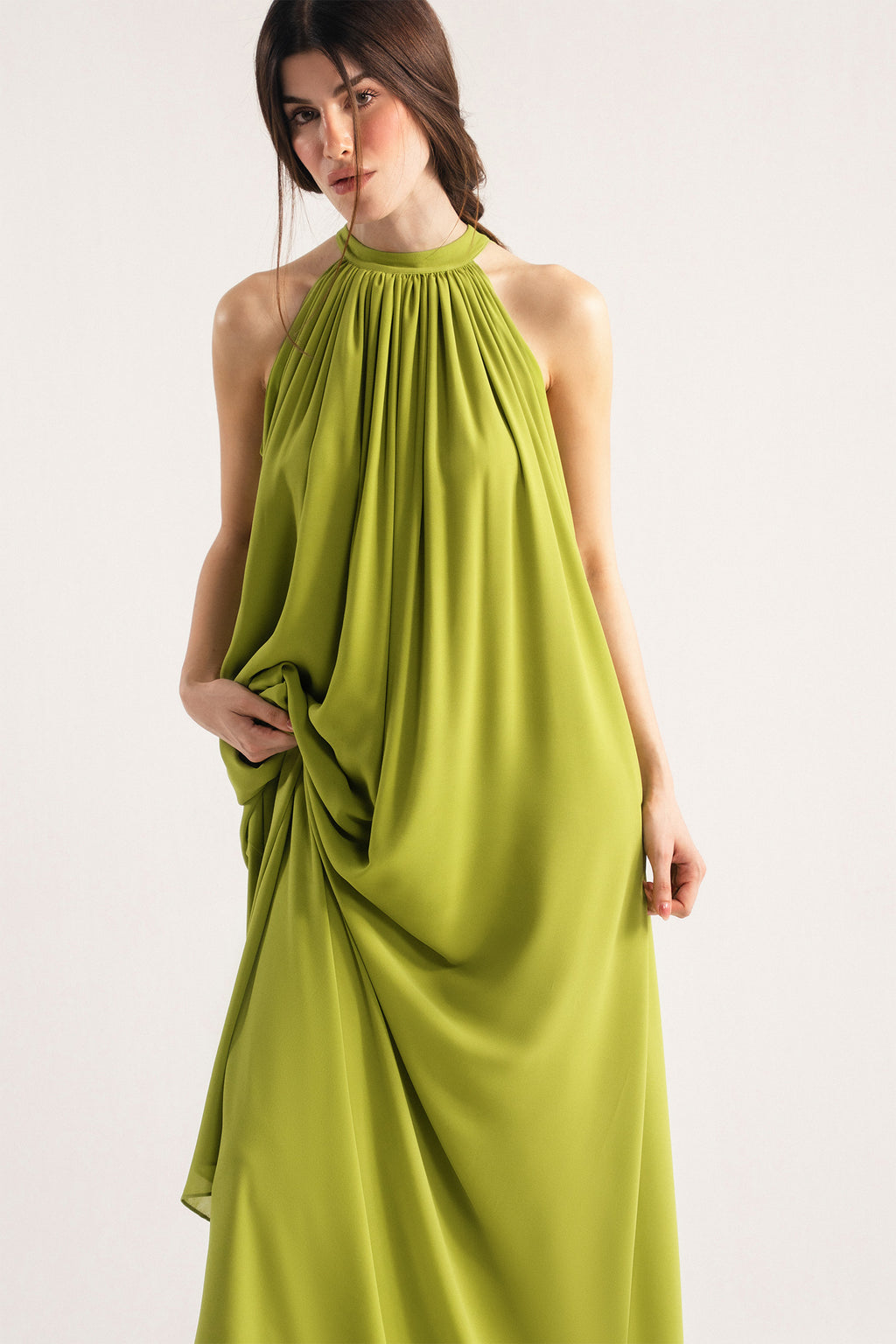 Close-up detail on the green hatter neck a-line maxi dress, by SOLA Pakistan.