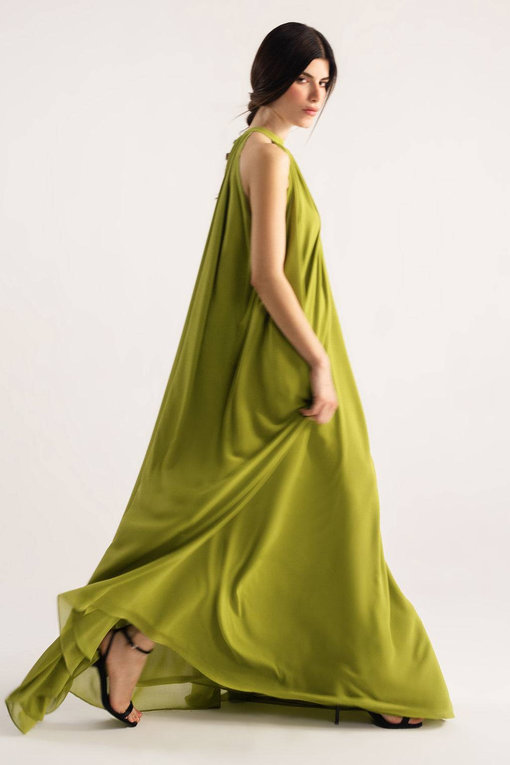 Flat lay of the green hatter neck a-line maxi dress, by SOLA Pakistan.