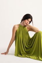 Green hatter neck a-line maxi dress shown in a styled fit, by SOLA Pakistan.