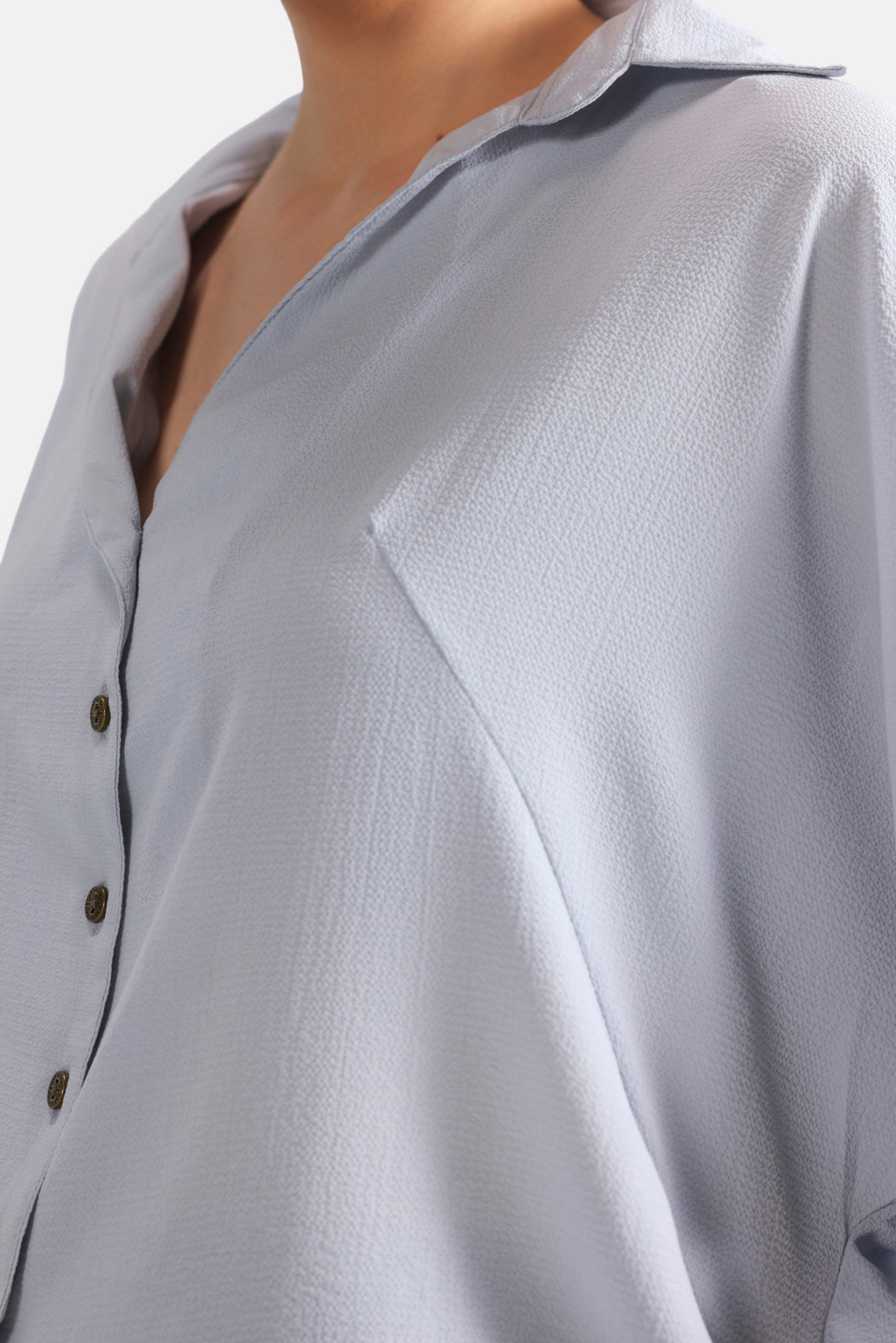 Texture and fabric detail, grey bubble hem oversized top, by SOLA Pakistan.