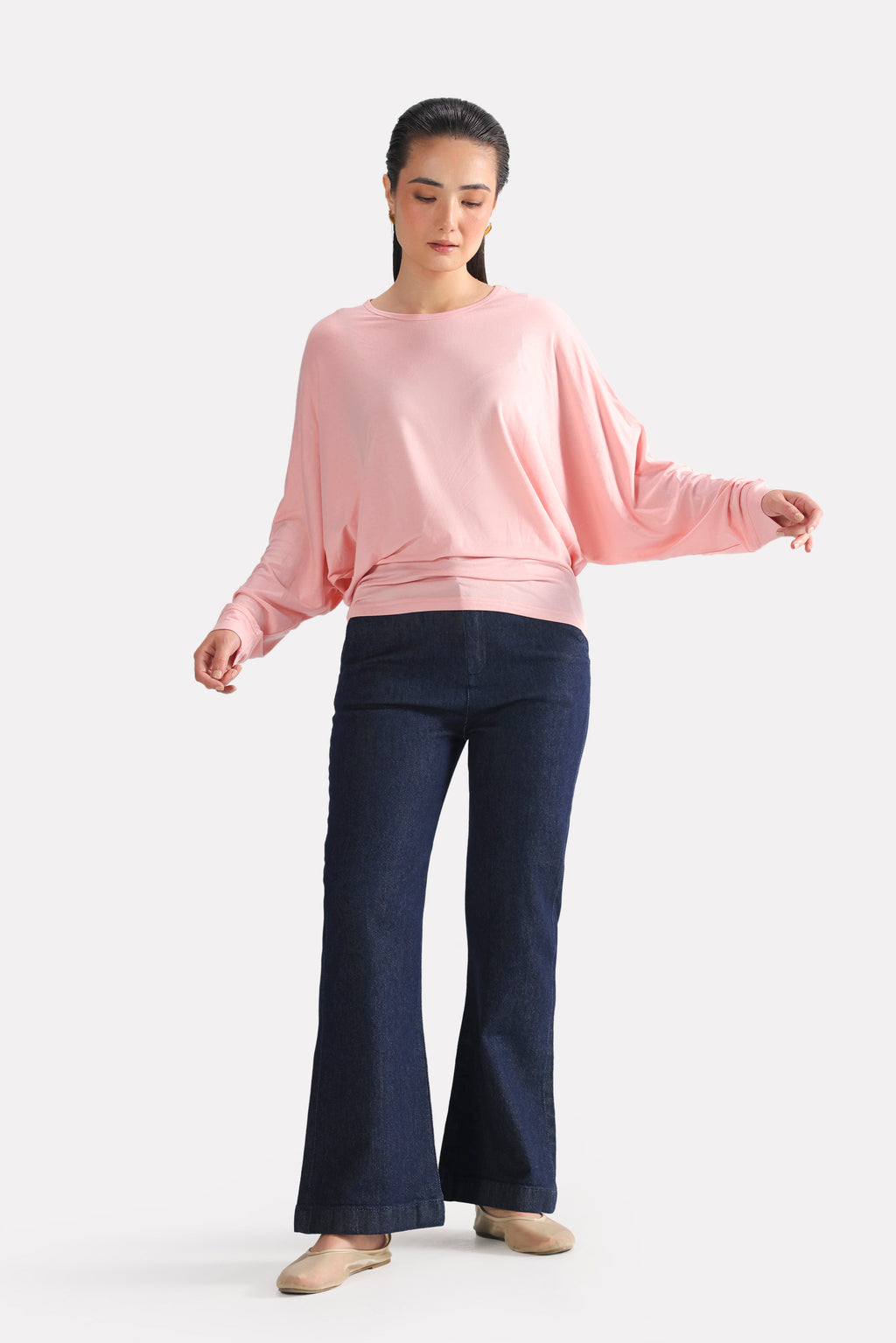 Close-up detail on the light pink fluid sleeve t-shirt, by SOLA Pakistan.
