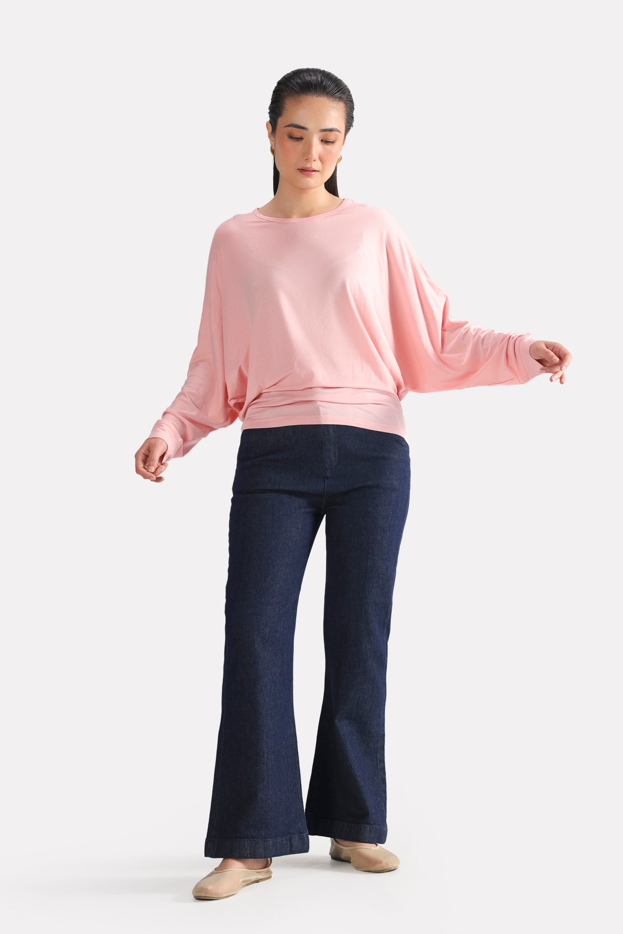 Close-up detail on the light pink fluid sleeve t-shirt, by SOLA Pakistan.