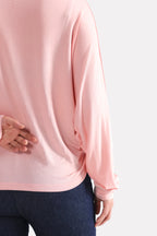 Flat lay of the light pink fluid sleeve t-shirt, by SOLA Pakistan.