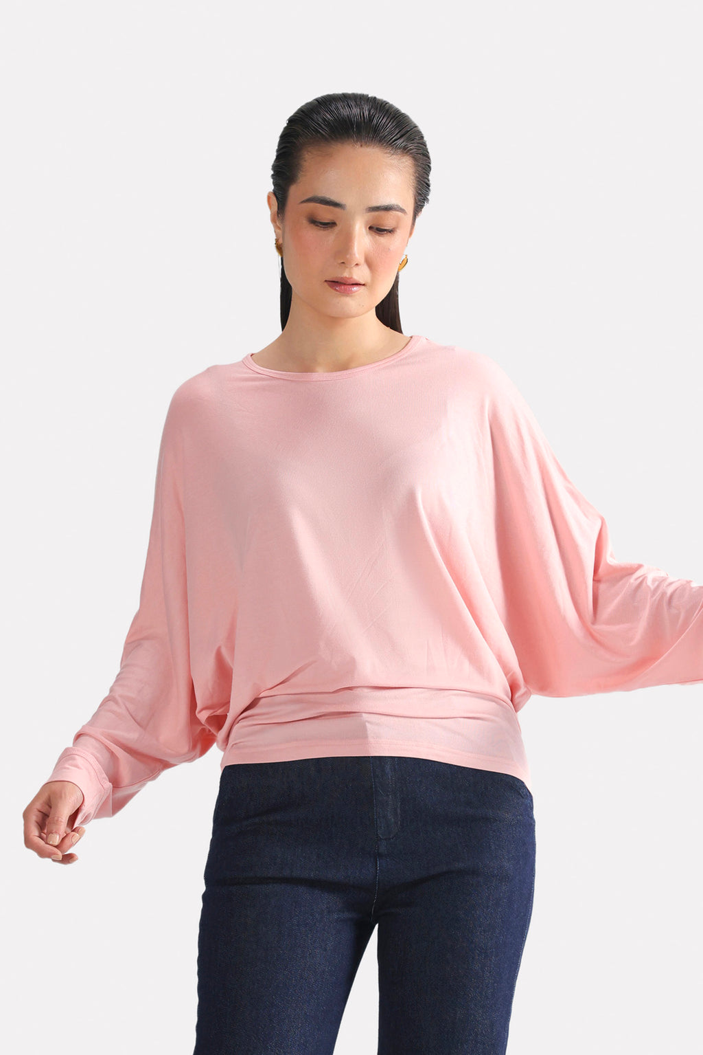 Light pink fluid sleeve t-shirt in modal, worn by a model, by SOLA Pakistan.
