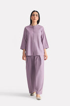 Light purple (lilac) loop & lounge bottom in cotton-linen blend, worn by a model, by SOLA Pakistan.