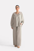 Mid grey structured ensemble bottom in cotton, worn by a model, by SOLA Pakistan.