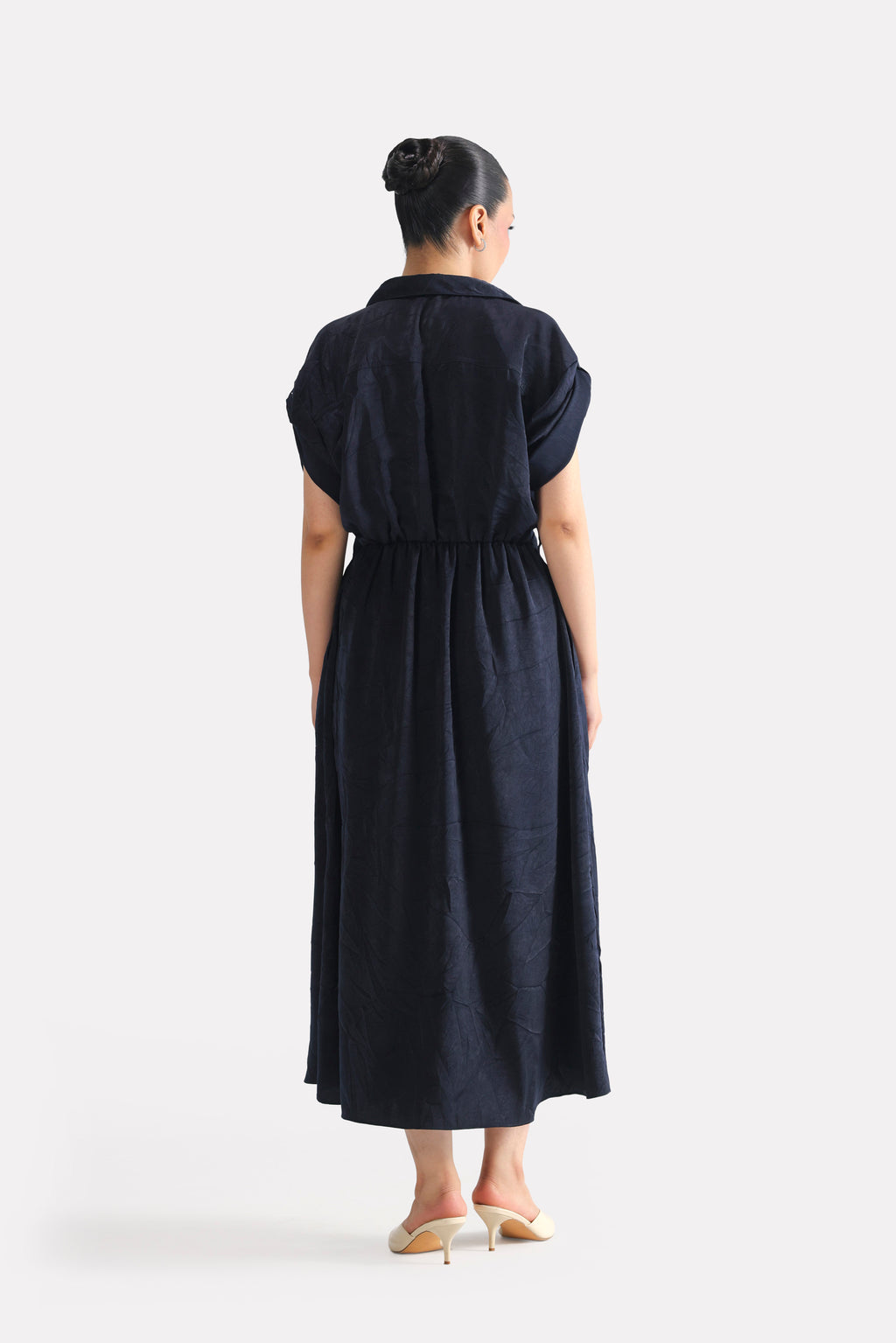 Close-up detail on the mid night blue cap sleeve shift dress, by SOLA Pakistan.