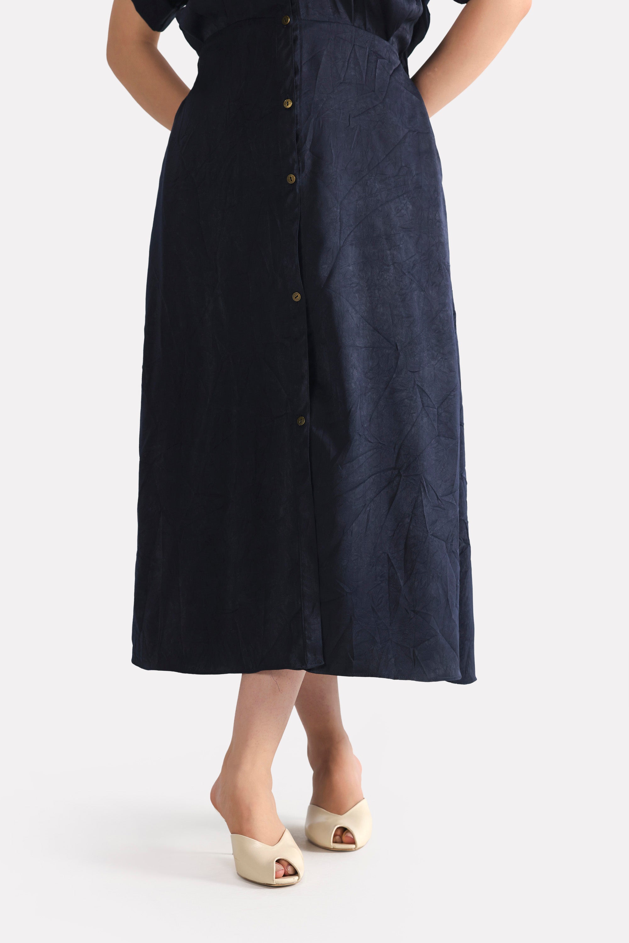 Flat lay of the mid night blue cap sleeve shift dress, by SOLA Pakistan.