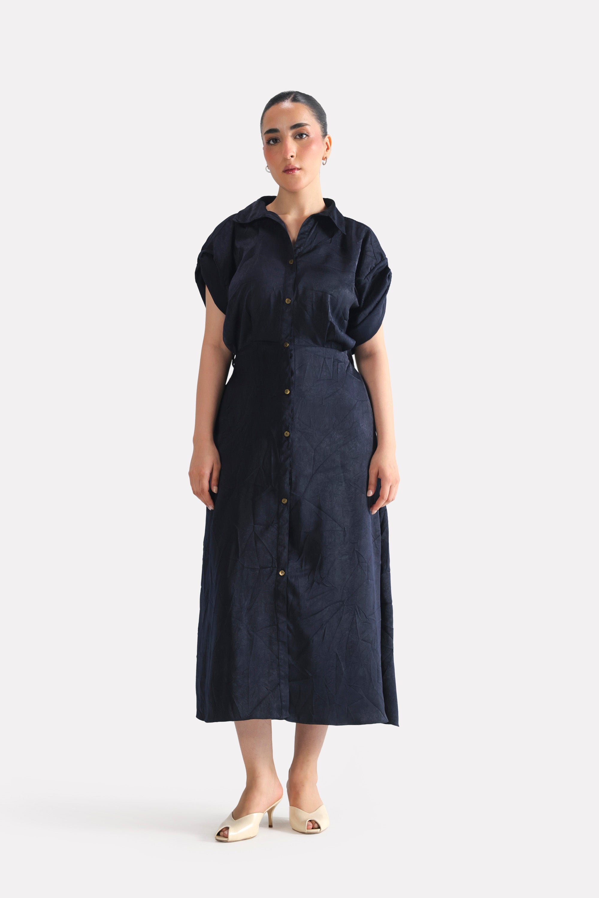 Mid night blue cap sleeve shift dress in polyester-silk blend, worn by a model, by SOLA Pakistan.