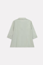 Flat lay of the mint green loop & lounge top, by SOLA Pakistan.