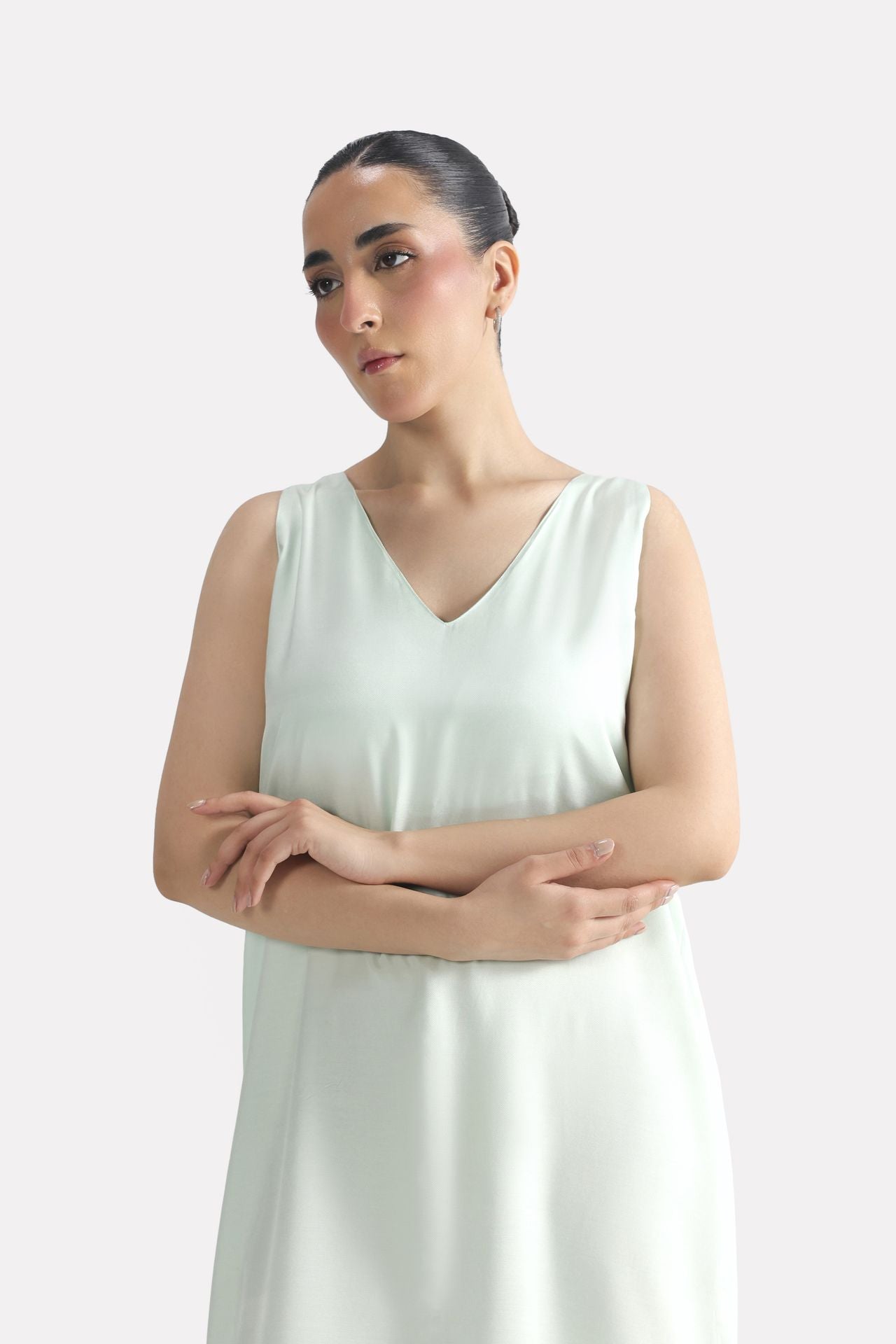 Close-up detail on the mint green lyocell slip maxi dress, by SOLA Pakistan.
