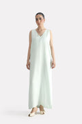Mint green lyocell slip maxi dress, worn by a model, by SOLA Pakistan.