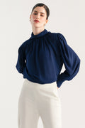 Navy blue gathered highneck blouse, worn by a model, by SOLA Pakistan.