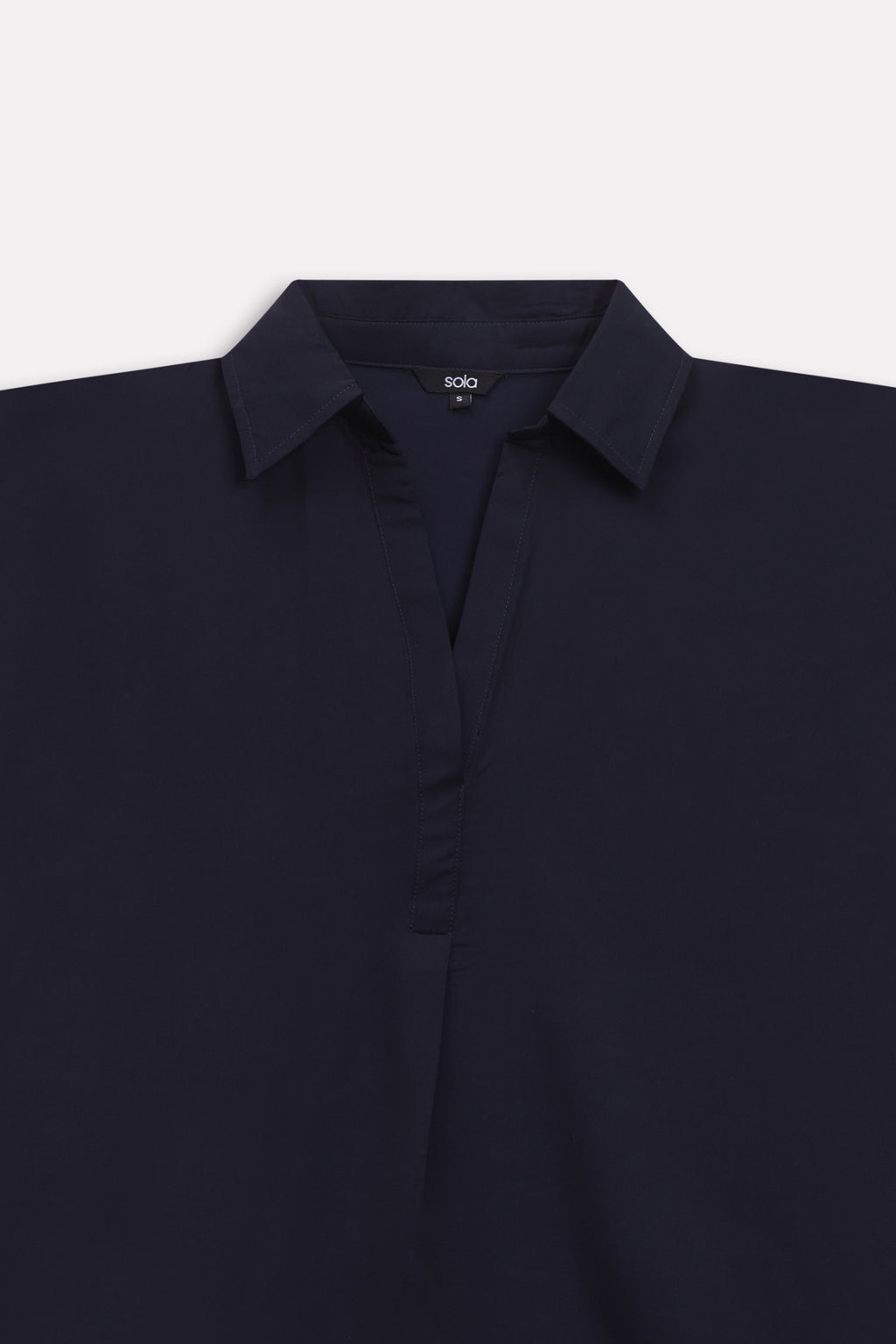 Additional view of the navy blue minimal cap sleeve woven shirt, by SOLA Pakistan.
