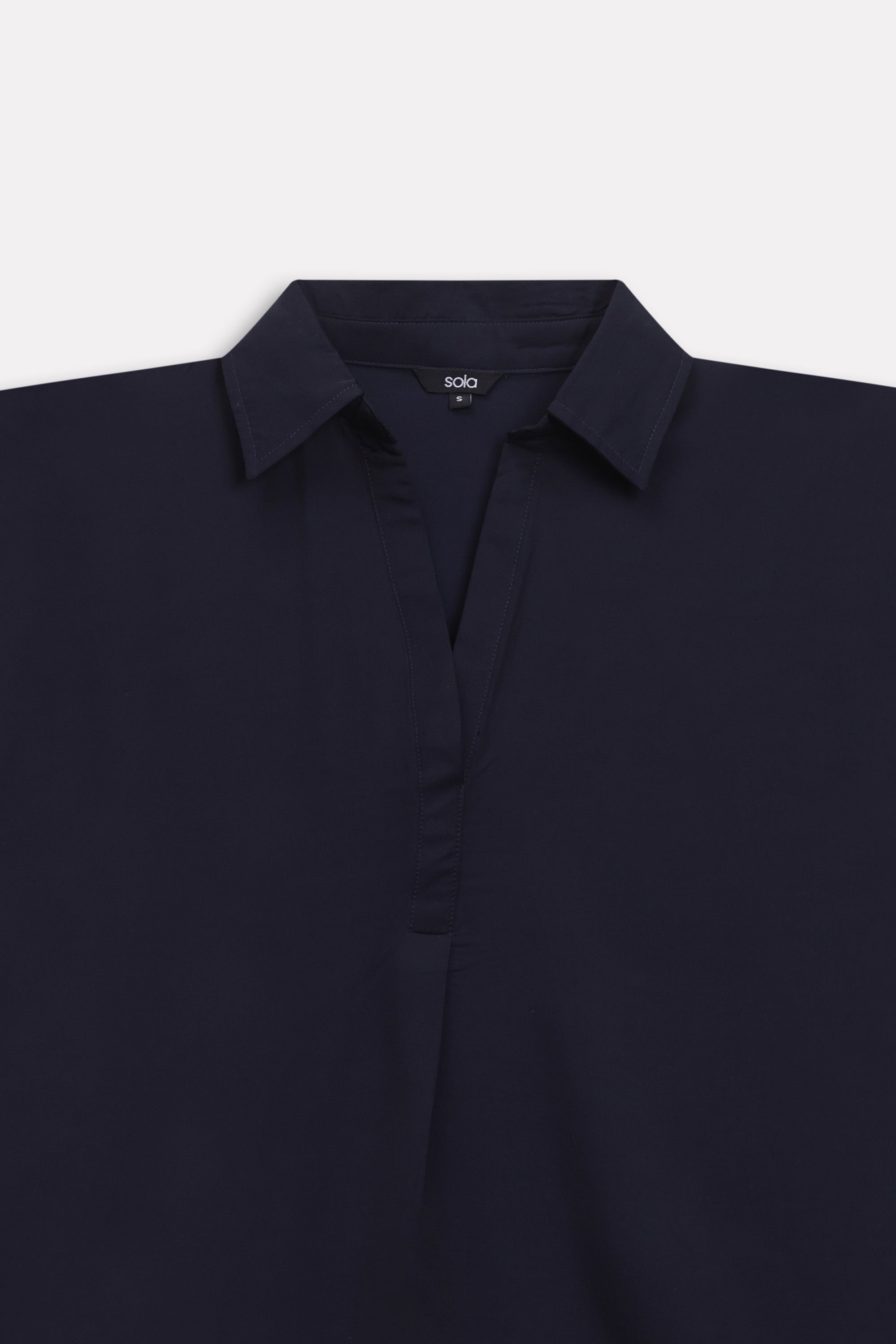 Additional view of the navy blue minimal cap sleeve woven shirt, by SOLA Pakistan.