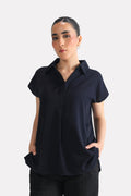 Navy blue minimal cap sleeve woven shirt in cotton, worn by a model, by SOLA Pakistan.