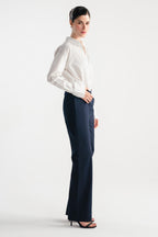 Close-up detail on the navy blue sculpted high waisted layered wide leg trouser, by SOLA Pakistan.