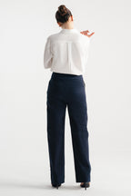 Flat lay of the navy blue sculpted high waisted layered wide leg trouser, by SOLA Pakistan.