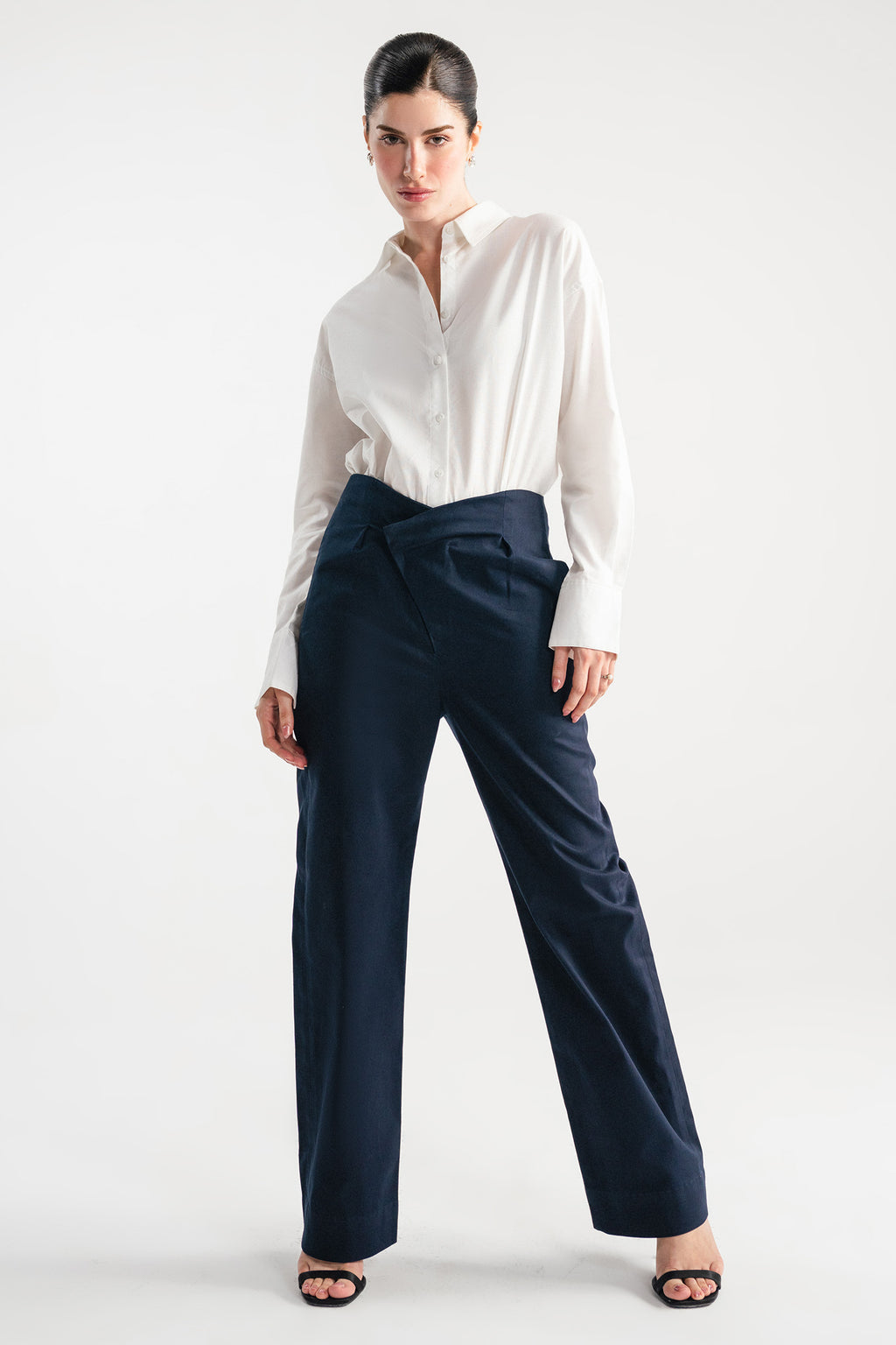 Navy blue sculpted high waisted layered wide leg trouser, full styled look, by SOLA Pakistan.