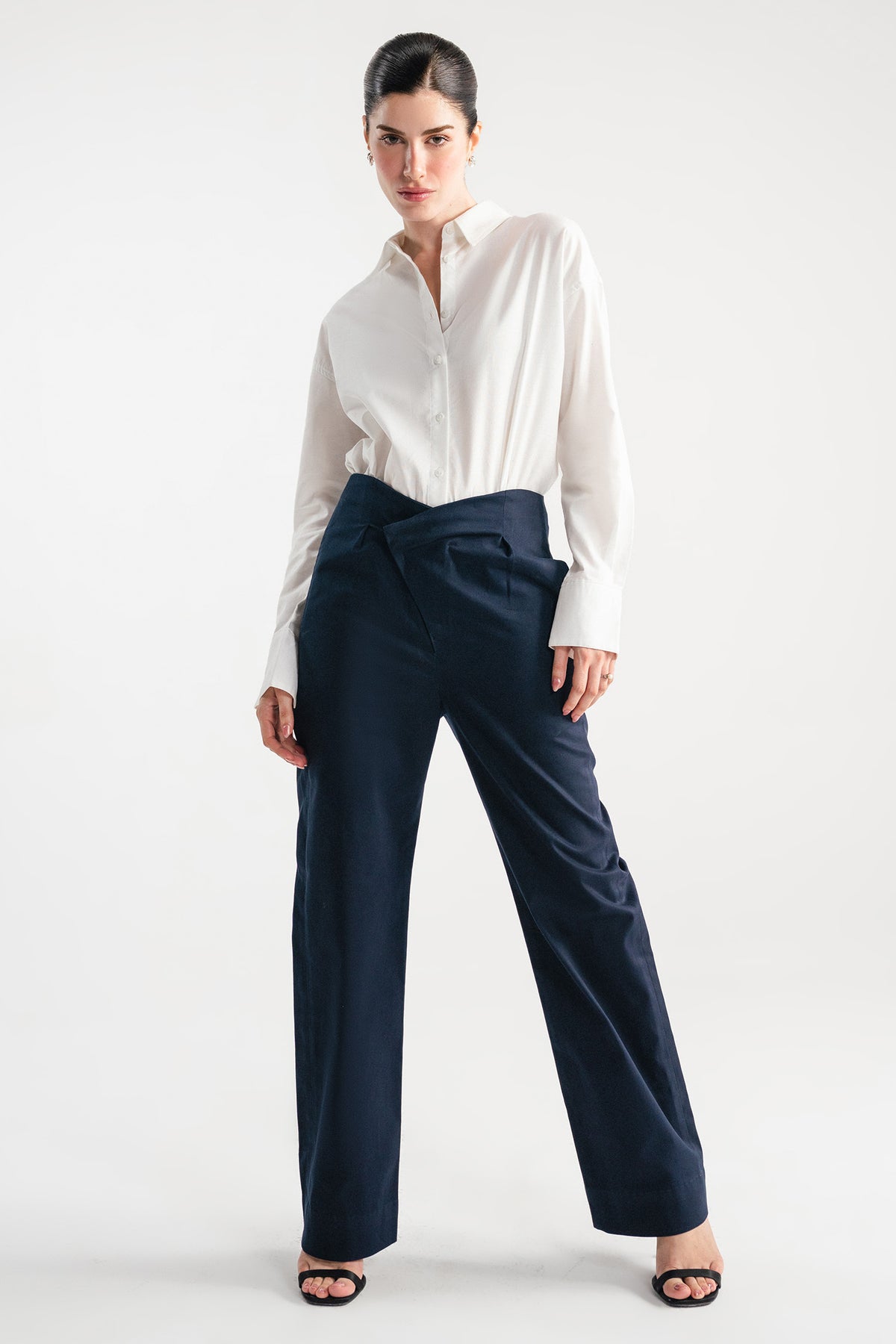 Navy blue sculpted high waisted layered wide leg trouser, full styled look, by SOLA Pakistan.
