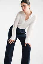 Navy blue sculpted high waisted layered wide leg trouser shown in a styled fit, by SOLA Pakistan.