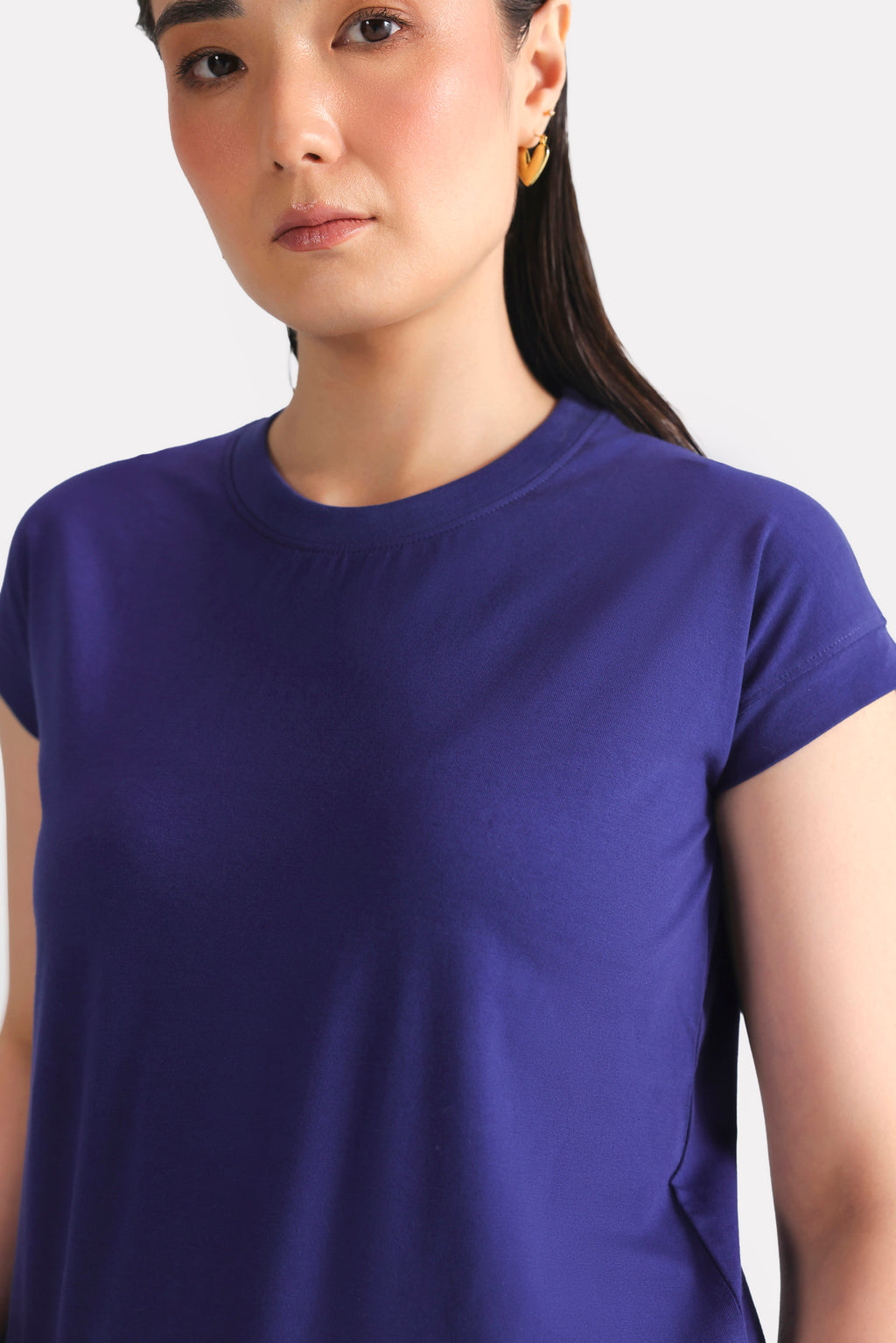 Close-up detail on the navy cap sleeve t-shirt, by SOLA Pakistan.