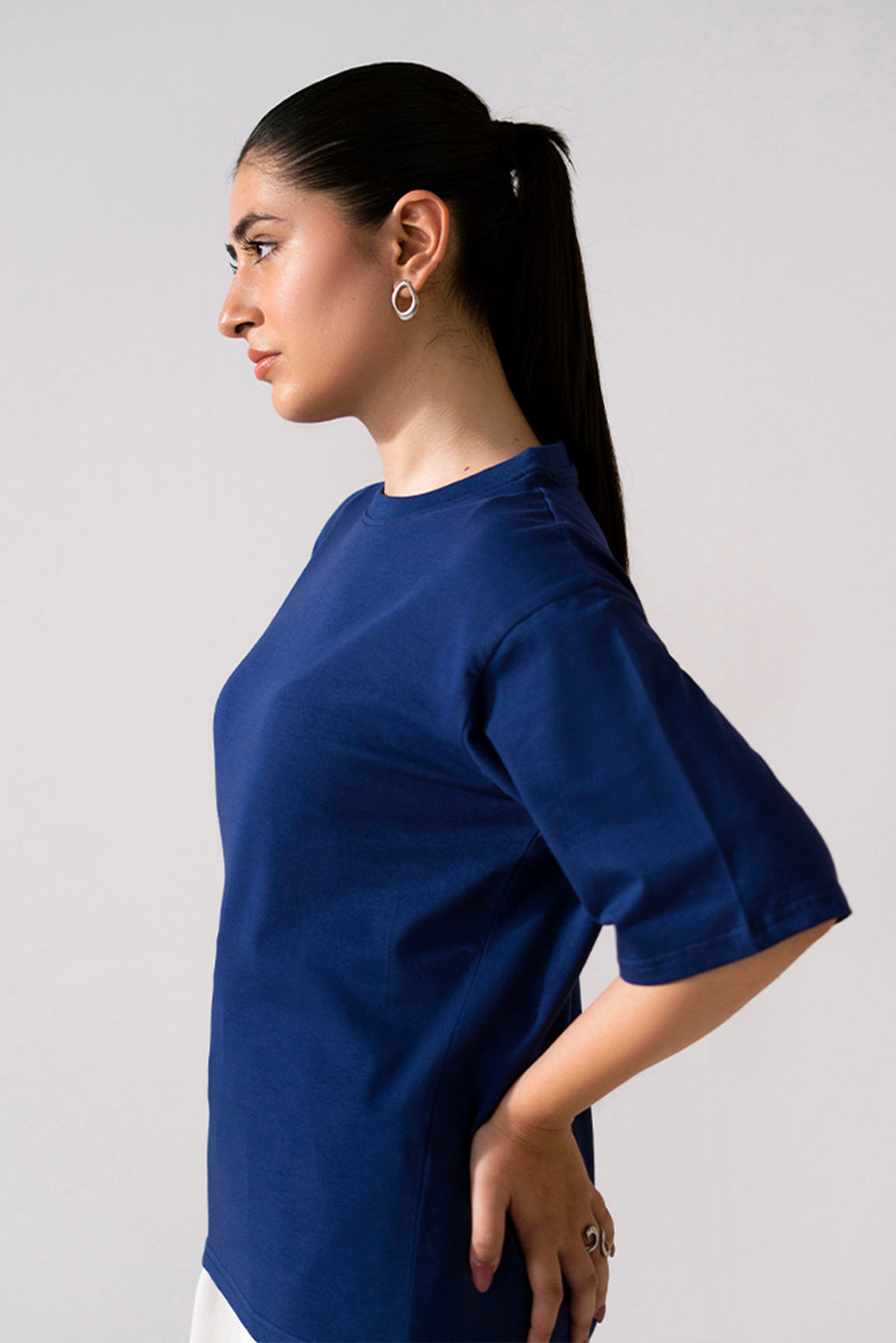 Close-up detail on the navy round neck t-shirt, by SOLA Pakistan.