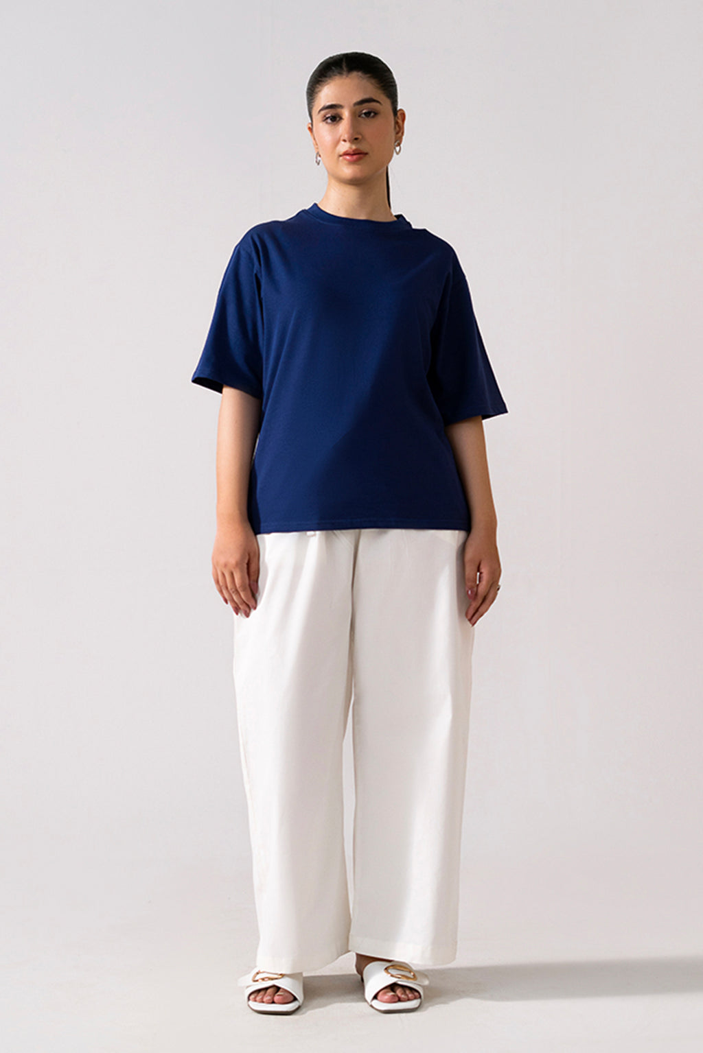 Navy round neck t-shirt shown in a styled fit, by SOLA Pakistan.