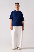 Navy round neck t-shirt shown in a styled fit, by SOLA Pakistan.