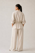 Off white cinched waist top shown in a styled fit, by SOLA Pakistan.